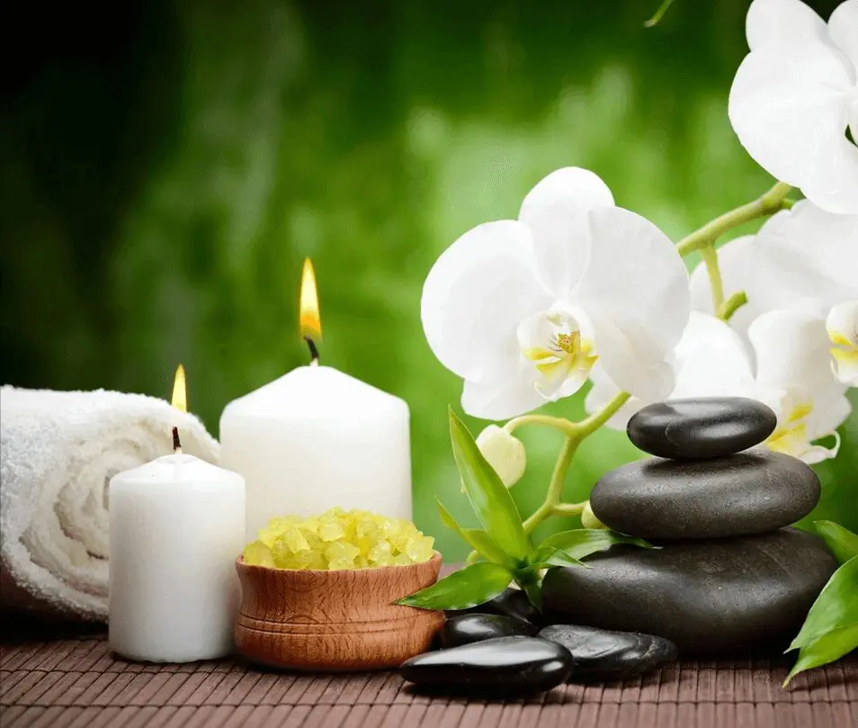 A table with candles and flowers on it